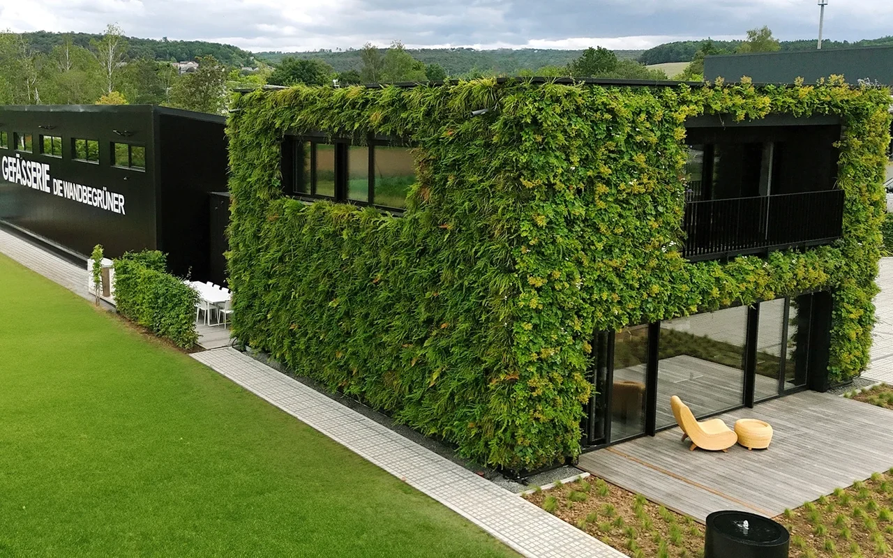 Modern building with a facade covered in a living green wall