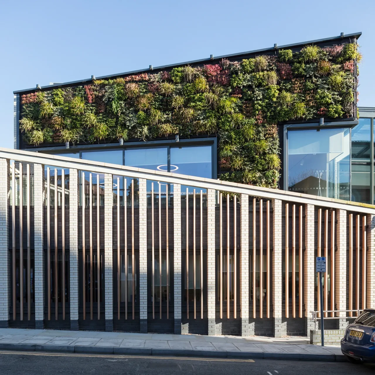 Building with a facade covered in a living green wall